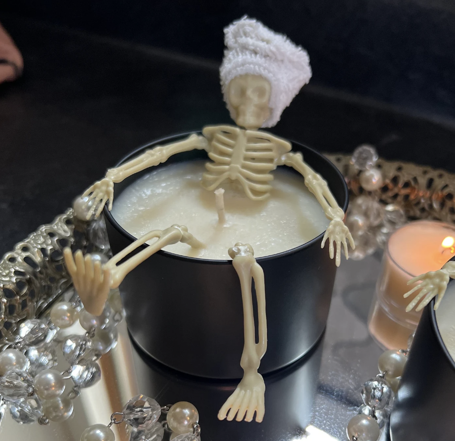 Plastic skeleton taking a bath in a candle for funny Halloween gift